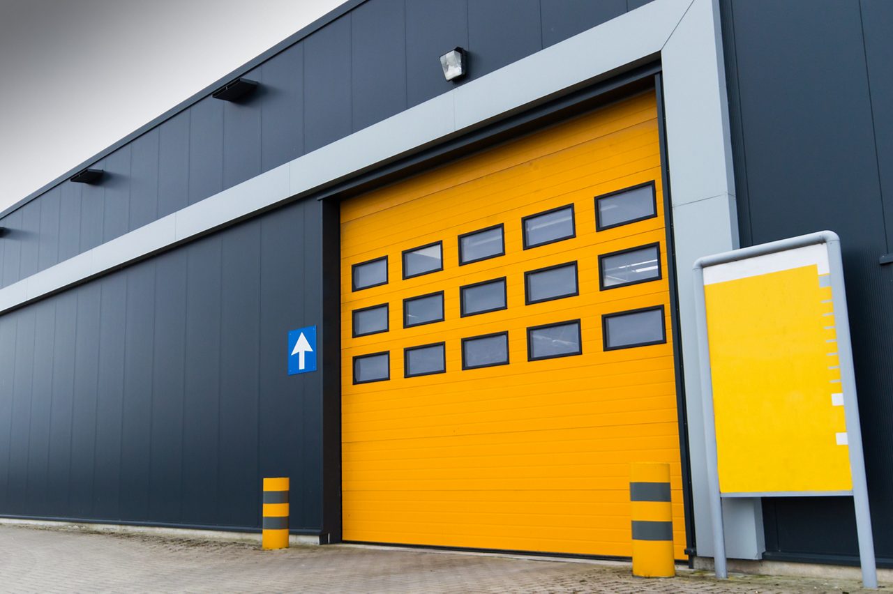 Warehouse with insulated loading dock door