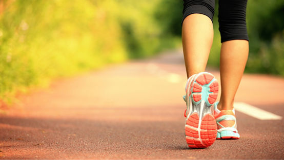 Woman running on trail