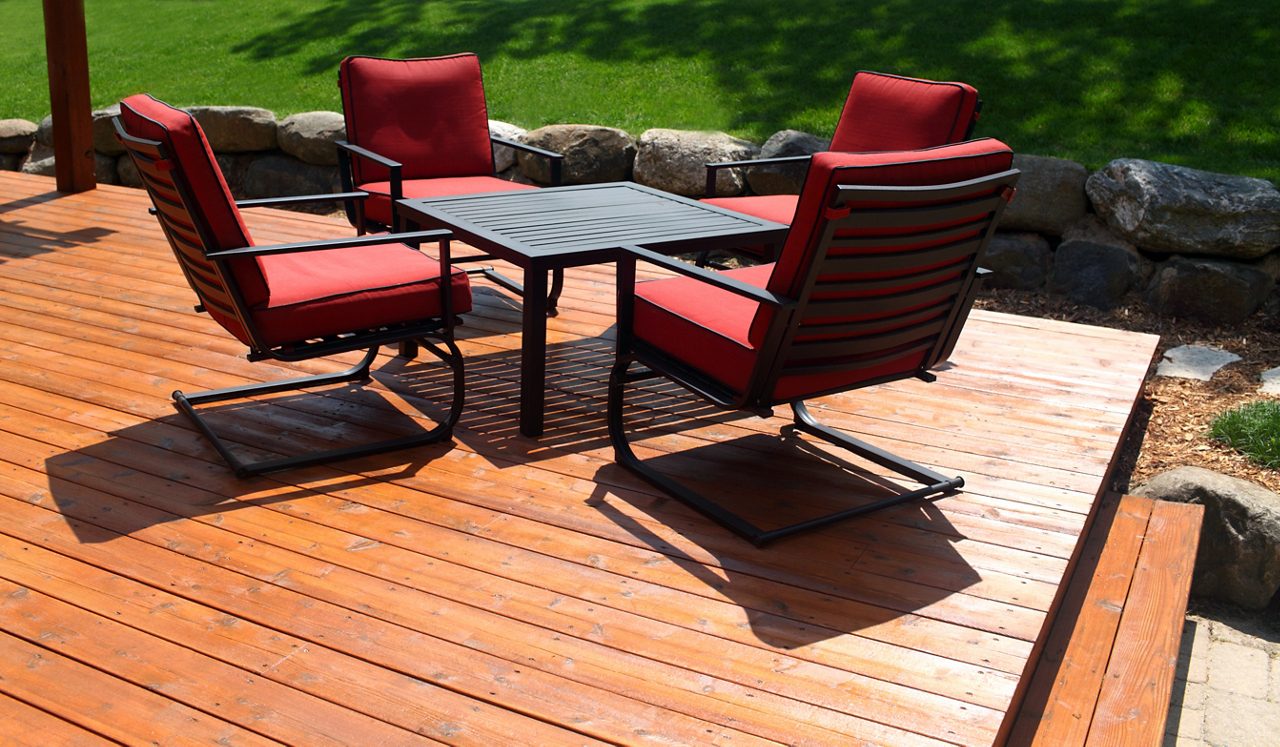 Outdoor furniture in the sun on a deck