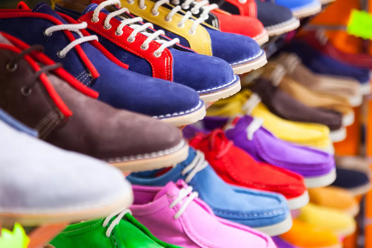 Counter with sport shoes at fashionable shop