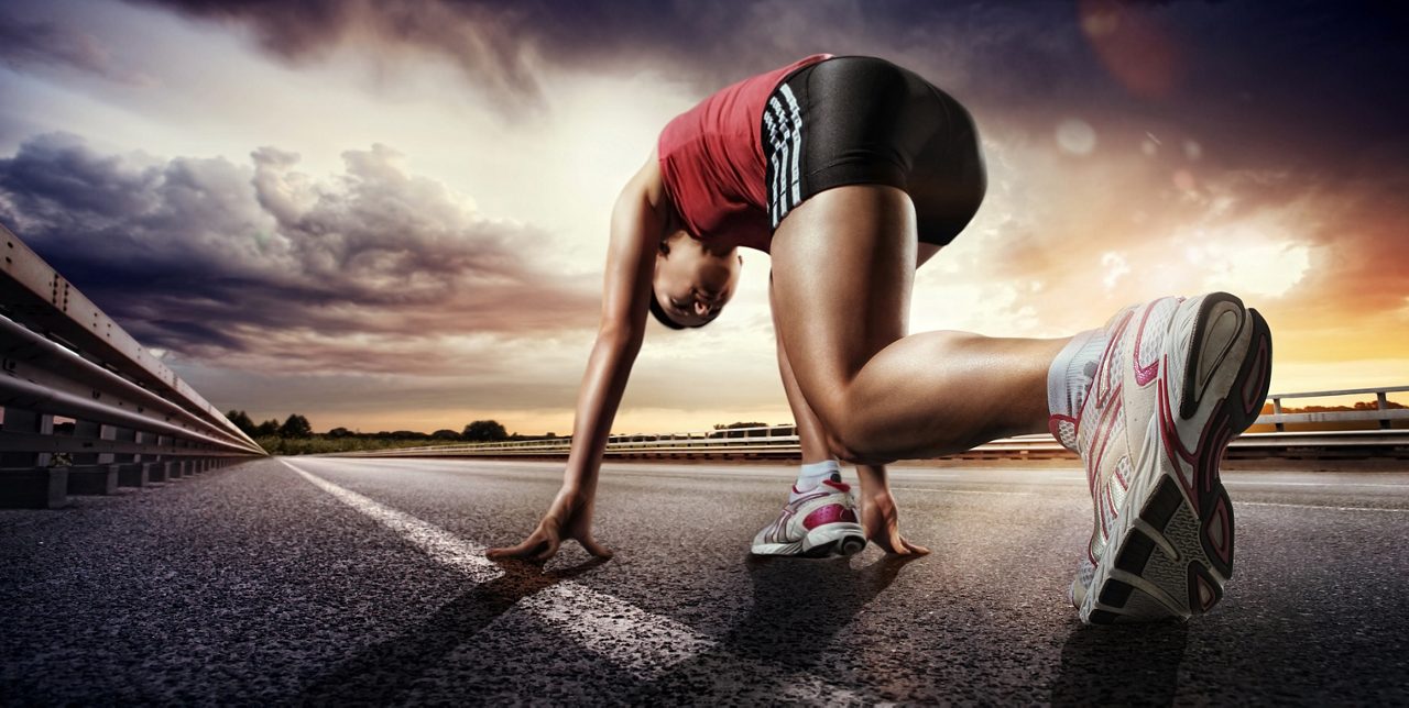 Runner preparing at the start line at sunset