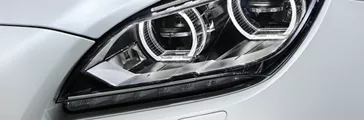 White car's front headlight