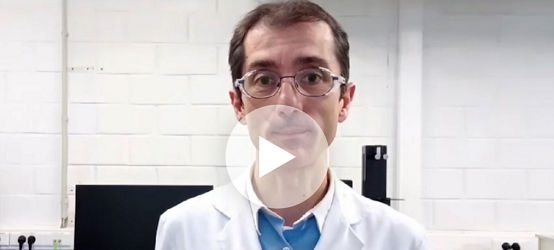 Scientist with play button overlay