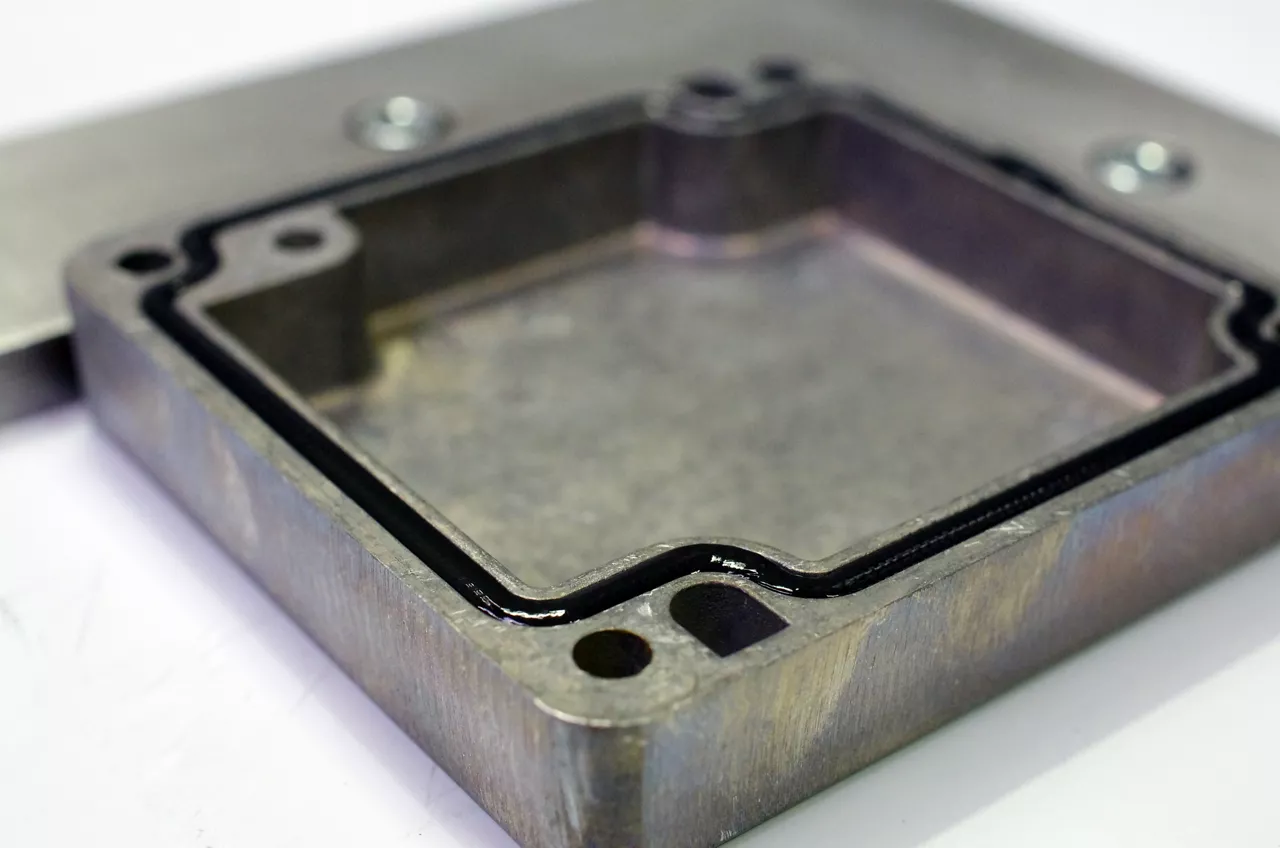 Black silicone adhesive dispensed 