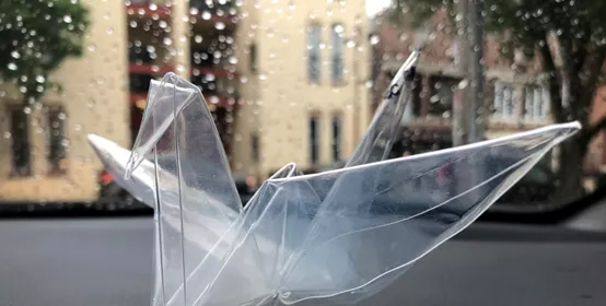 Origami crane made from clear plastic sheet