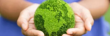 Women hands holding earth on green background. Save and protection Earth.Concept of the environment World Earth Day.