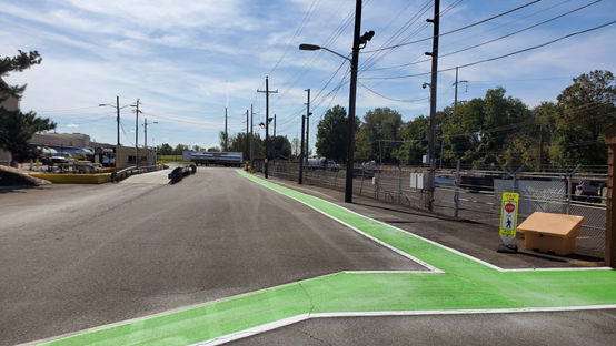 Industrial Wayfinding at Dow Croydon, PA Plant | view of painted green road markings on campus.