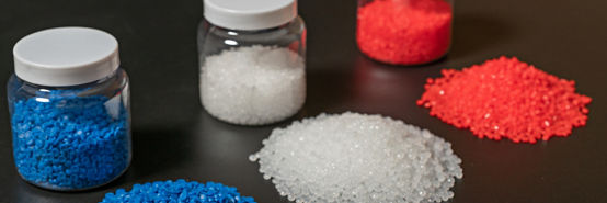 Close-up of plastic polymer granules. hand hold Polymer pellets. polymer plastic. compound polymer.