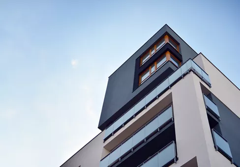 Modern apartment buildings on a sunny day with a blue sky. Facade of a modern apartment building