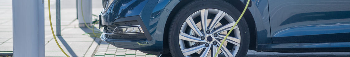 Cars plugged in at a public charging station