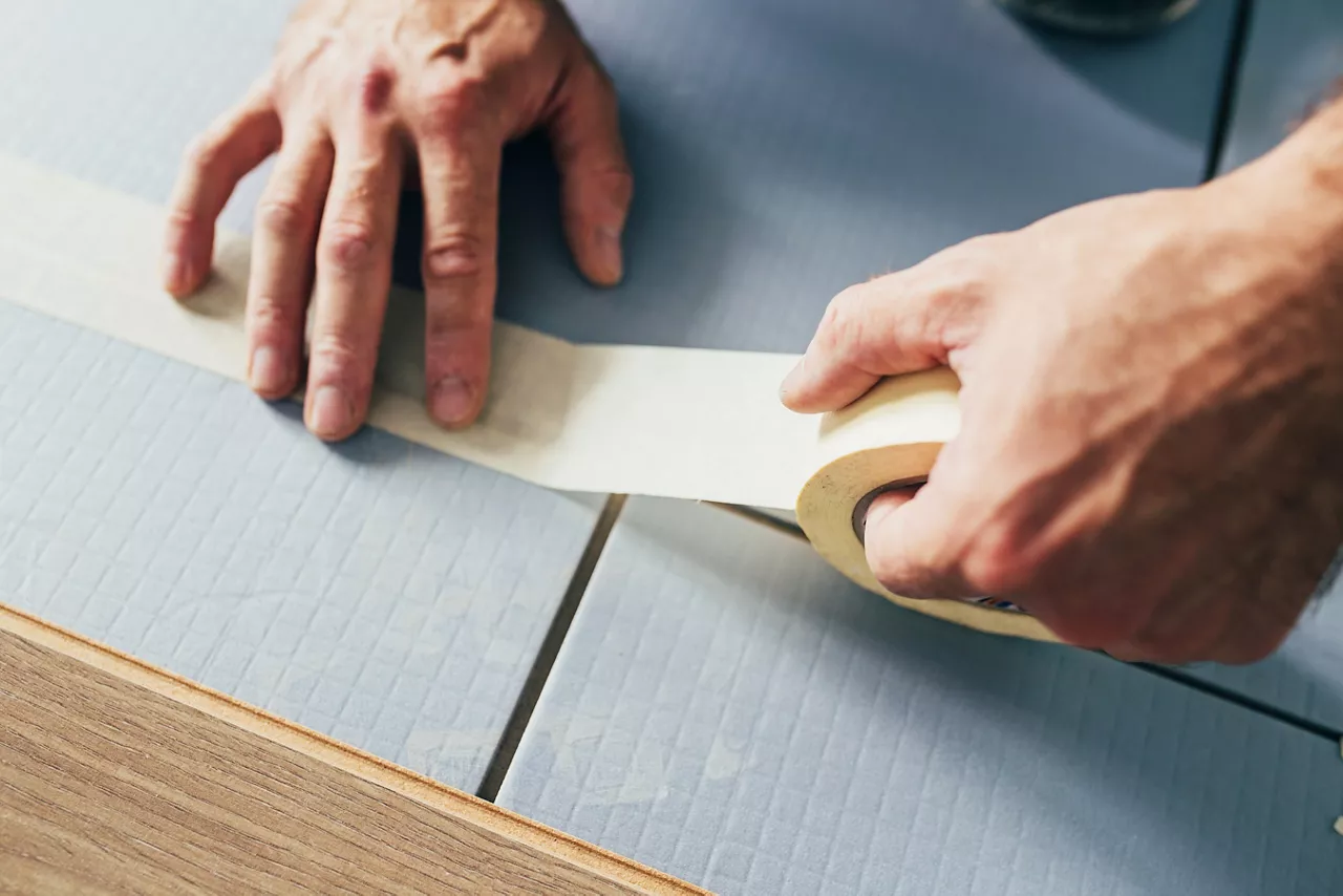 Bonding sheets of thermal insulation.