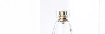 Elegant perfume bottle and white packaging boxes 