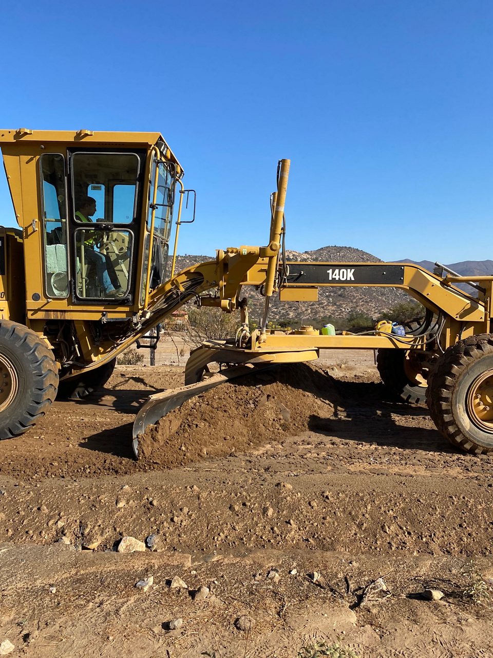 Soil stabilization process with road being built. 