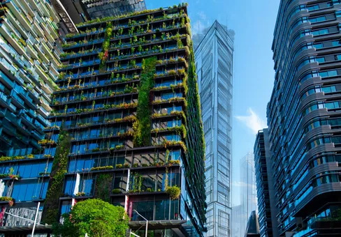 Apartment block in Sydney NSW Australia with hanging gardens and plants on exterior of the building