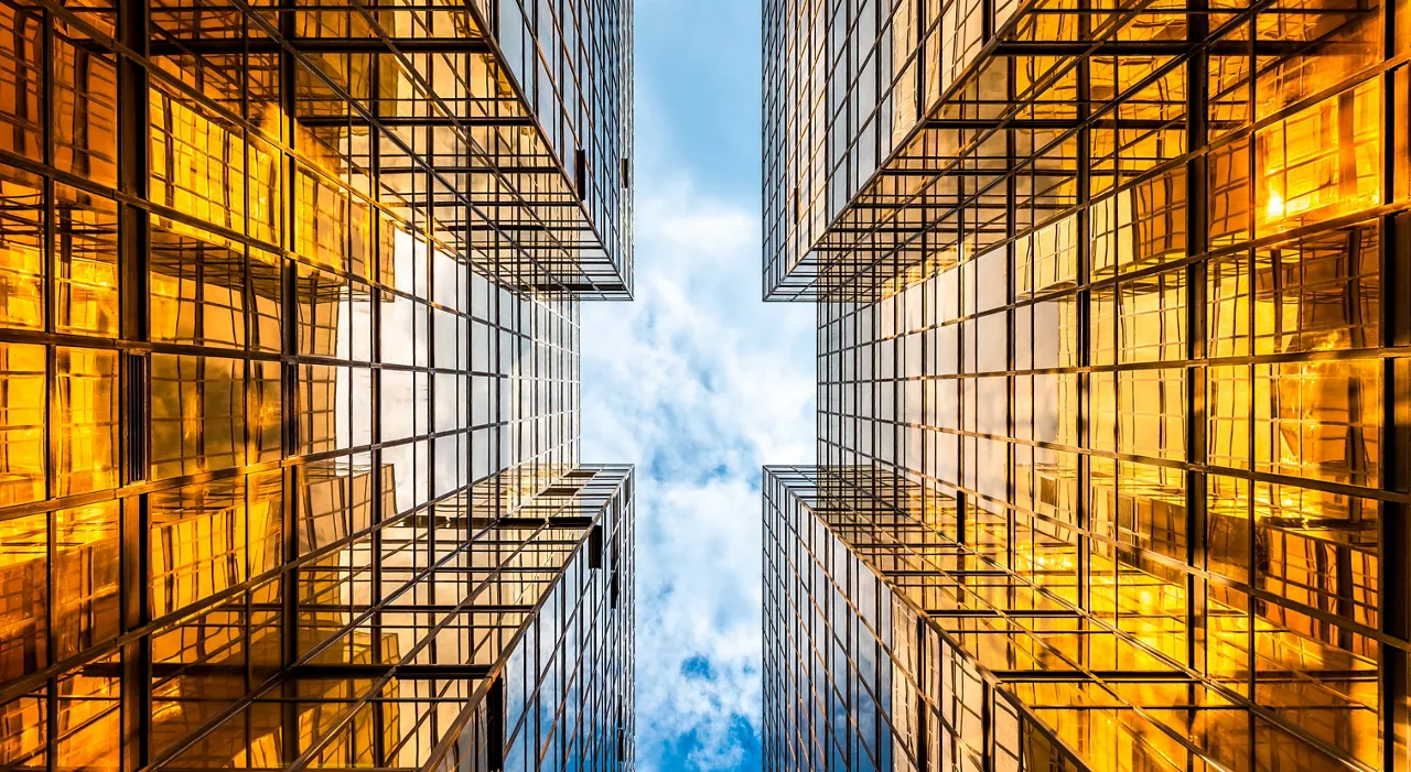 Golden tall buildings and glass reflections