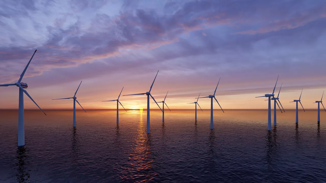 Offshore Wind Turbines Farm at sunset