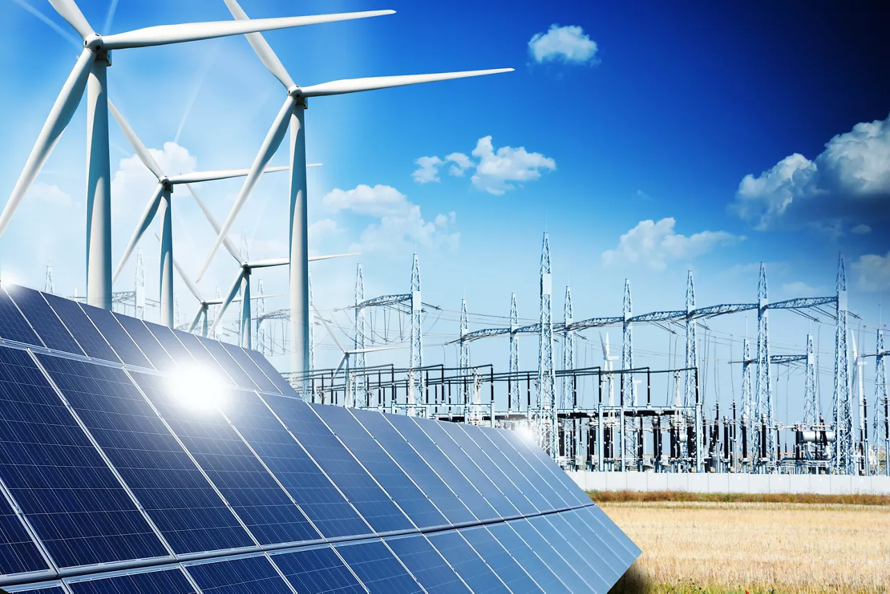 Modern electric grid lines and renewable energy concept with photovoltaic panels and wind turbines