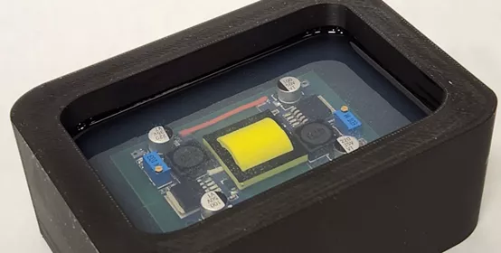 Picture of DOWSIL™ OR-2000 Standard Hard Gel potting a mock board.