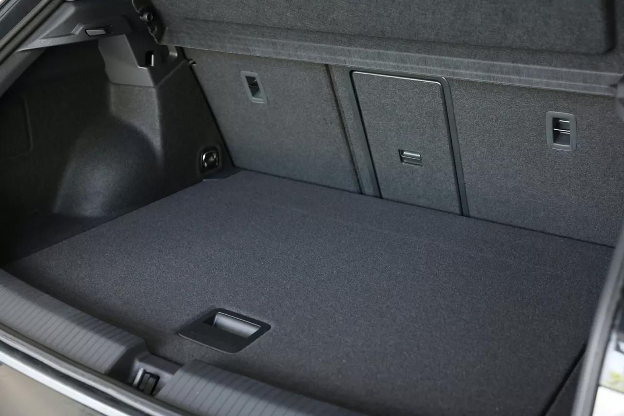 Grey soft car boot liner mat in trunk of auto