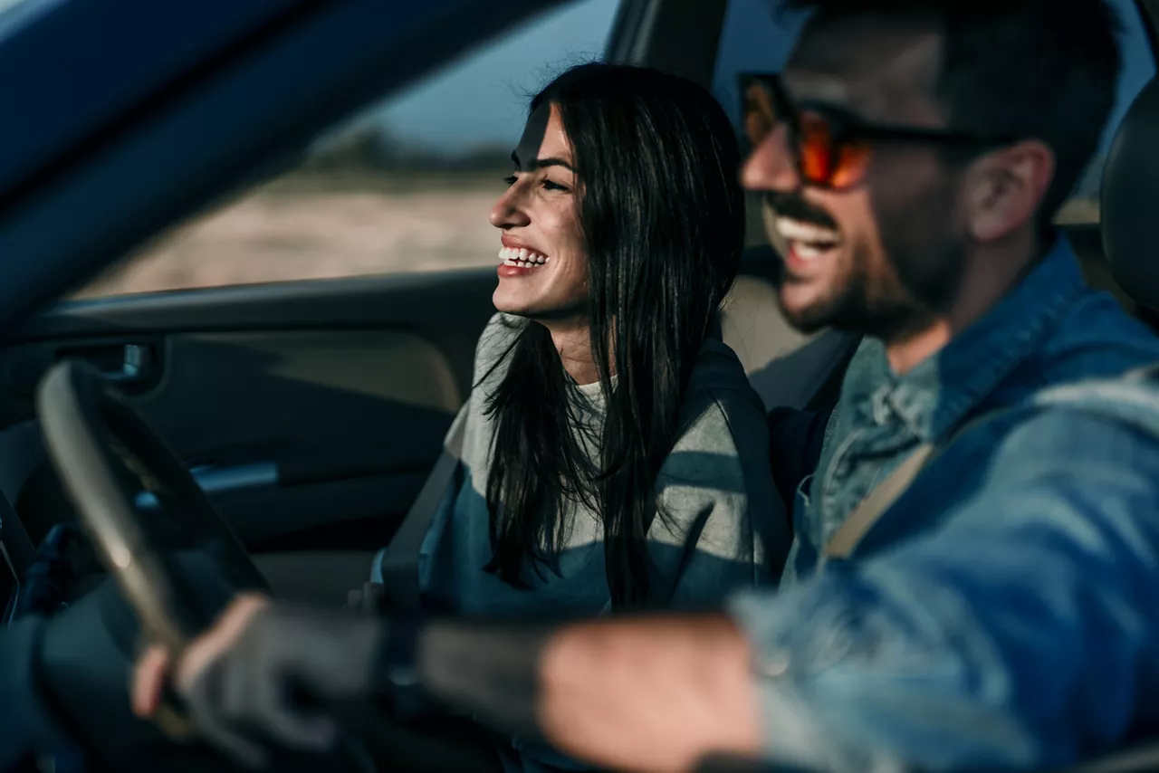 Couple in car during sunset