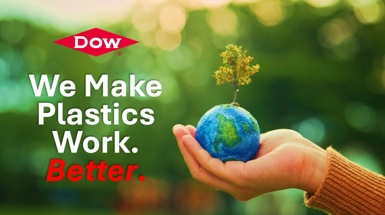 Hand holding Earth with We Make Plastics Work. Better text