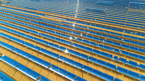 Aerial view of a solar farm producing clean renewable sun energy in California, industrial landscape.