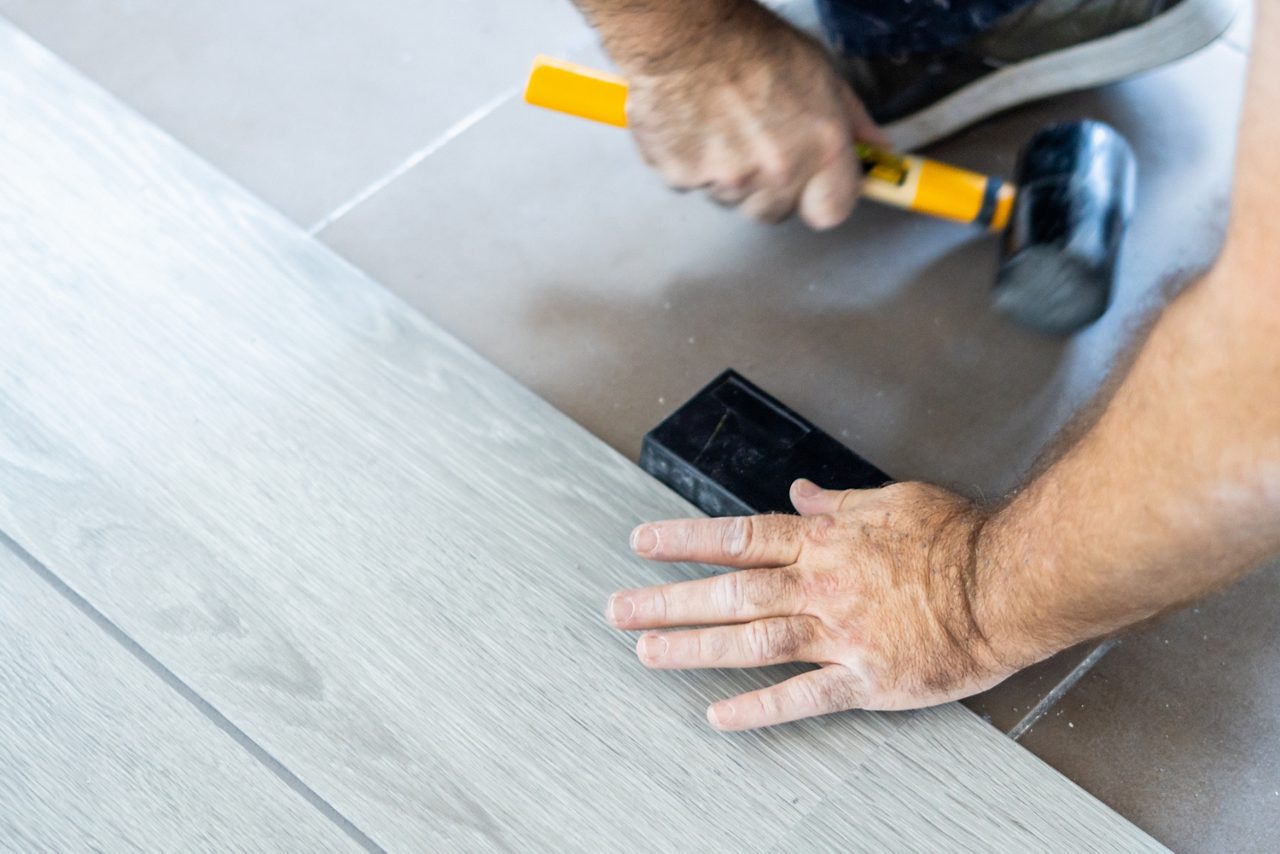 Rubber mallet used by the carpenter to adjust the sheets of vinyl flooring