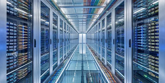 Modern Data Center Server Room with Rows of Racks and Cables