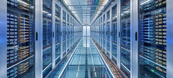 Modern Data Center Server Room with Rows of Racks and Cables
