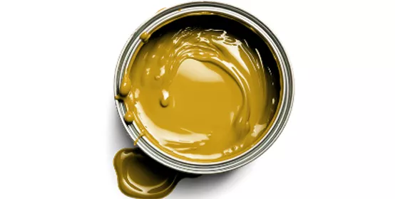 Top‑down view of an open paint can filled with smooth yellow paint on a clean white background. The image highlights color intensity, texture, and fluidity, conveying themes of coatings performance, color science, material formulation, and industrial innovation.