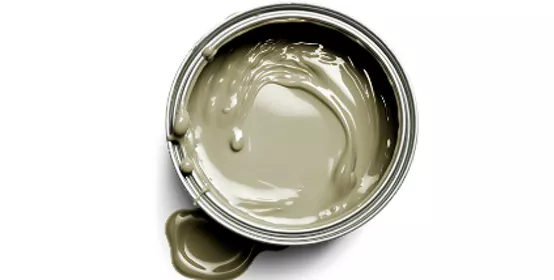 Top‑down view of an open paint can filled with smooth gray paint on a clean white background. The image highlights color intensity, texture, and fluidity, conveying themes of coatings performance, color science, material formulation, and industrial innovation.