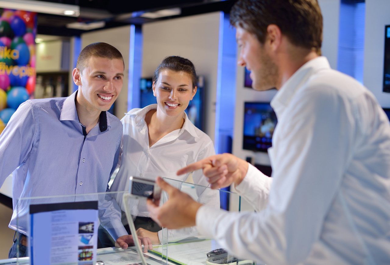 People in store viewing consumer electronics 