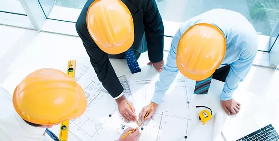 Image of constructor workers sketching together on the foreground viewed below; Shutterstock ID 157412990; PO: redownload; Job: redownload; Client: redownload; Other: redownload