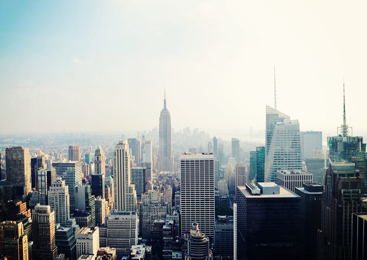 Early morning photo of city skyline with visible rooftops